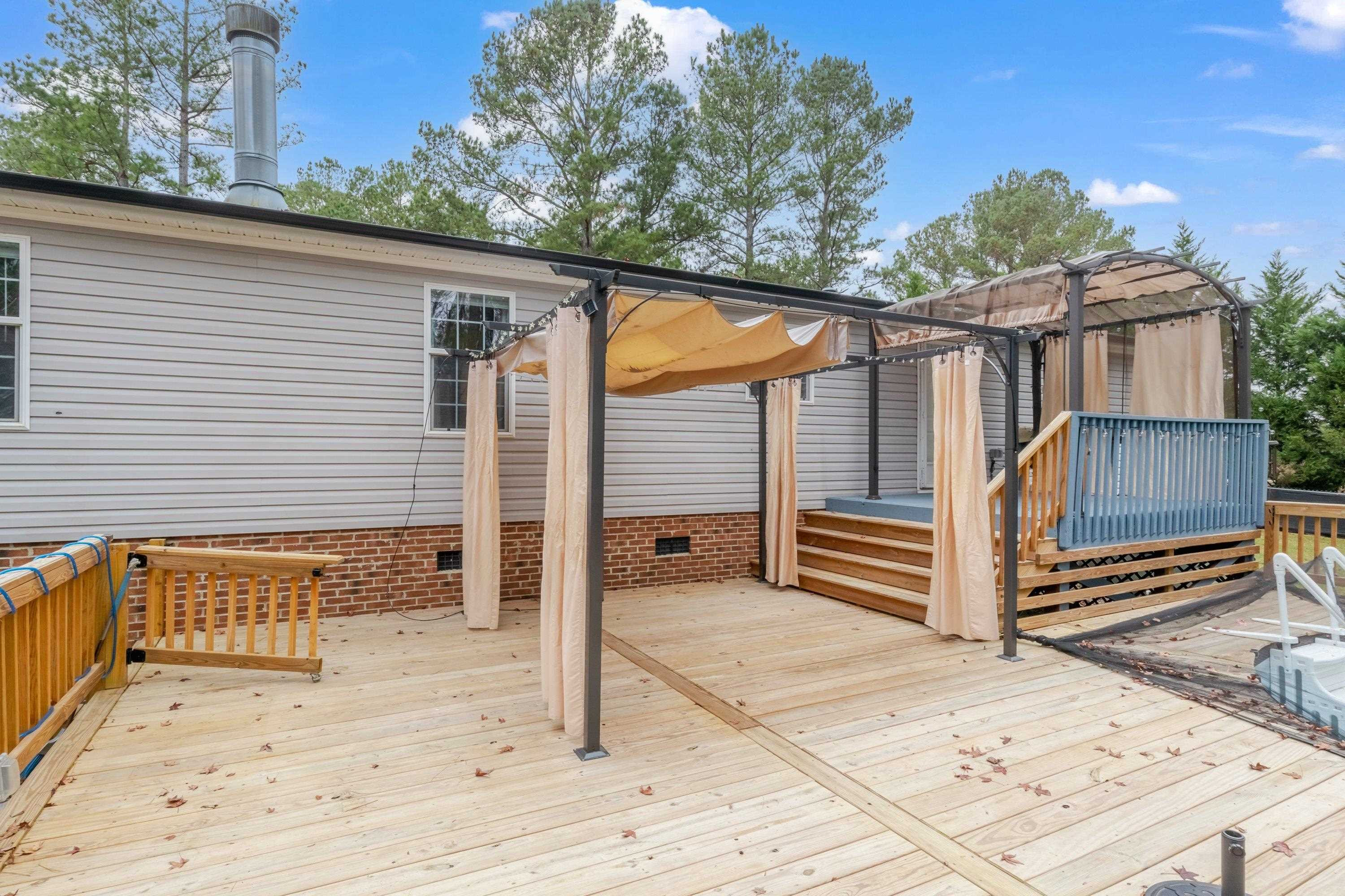 32 Red Oak Drive Smithfield, NC 27577 - Photo 37 of 47 a view of a house with backyard and wooden fence