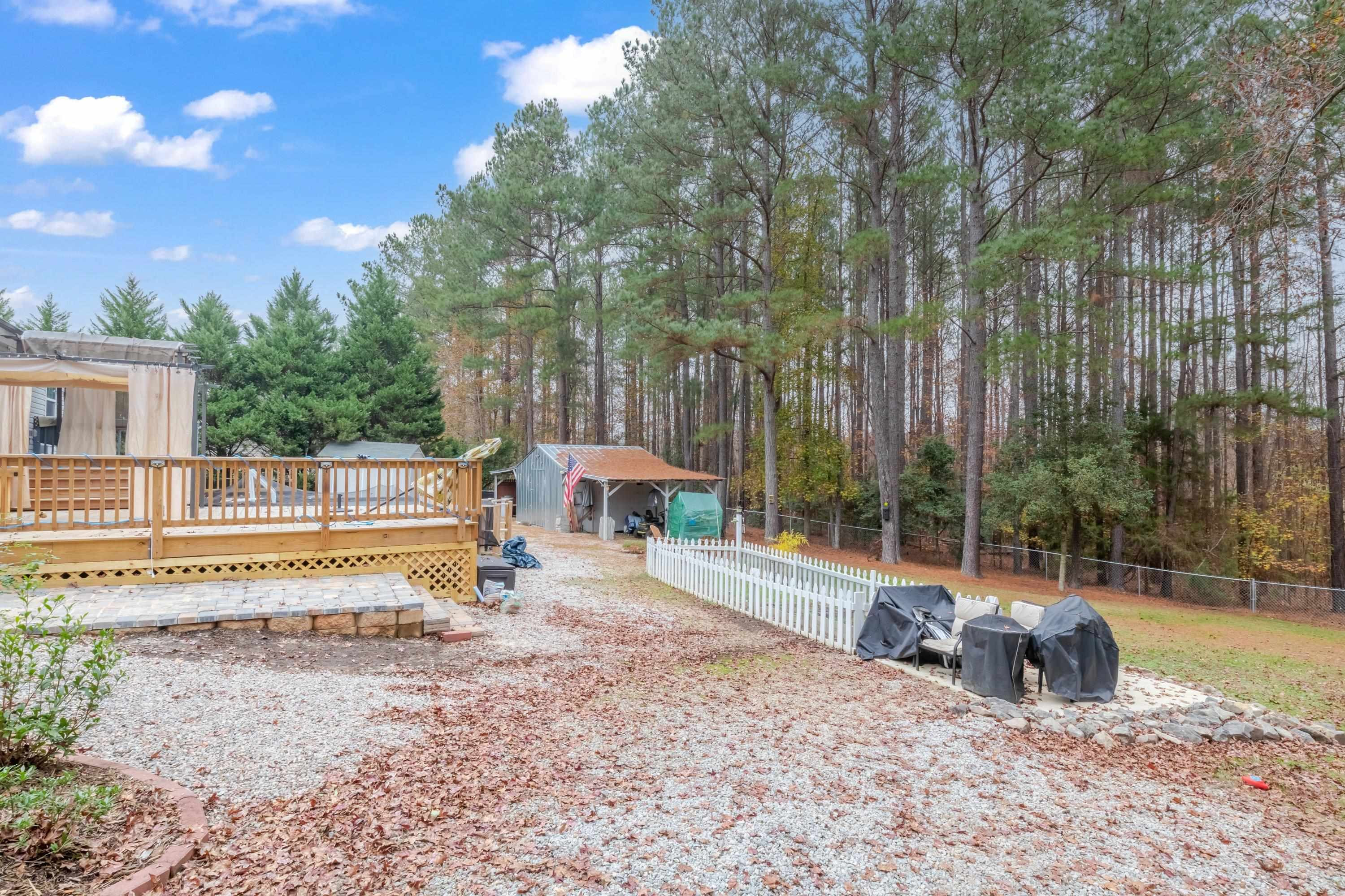 32 Red Oak Drive Smithfield, NC 27577 - Photo 39 of 47 a view of a house with backyard and sitting area