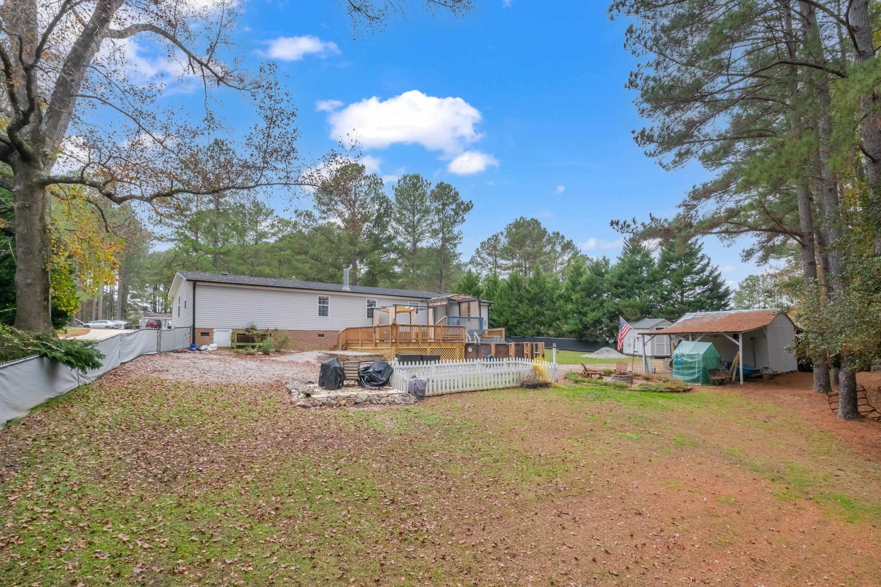 32 Red Oak Drive Smithfield, NC 27577 - Photo 40 of 47 a view of a house with backyard patio and sitting area