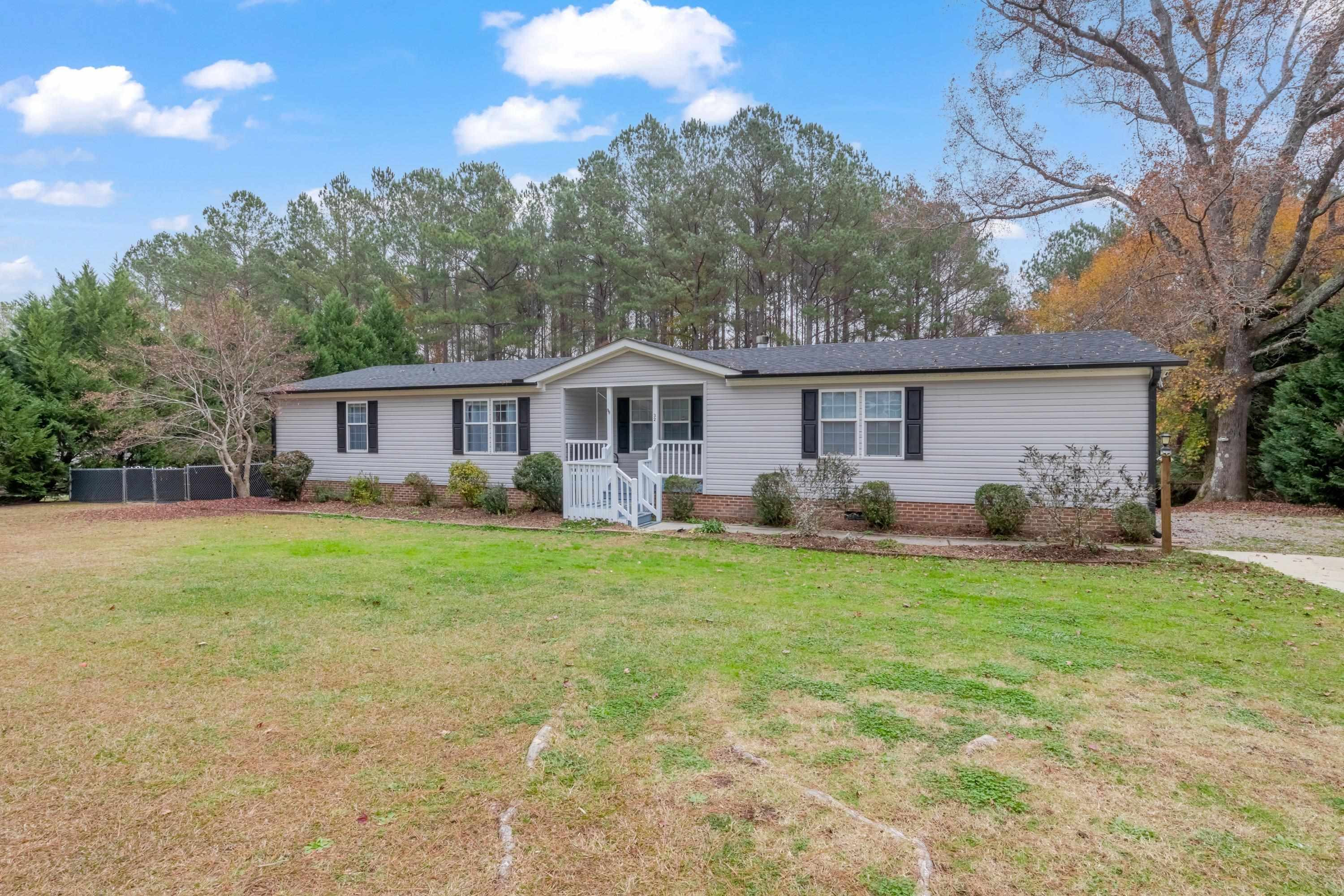 32 Red Oak Drive Smithfield, NC 27577 - Photo 4 of 47 a front view of a house with a garden