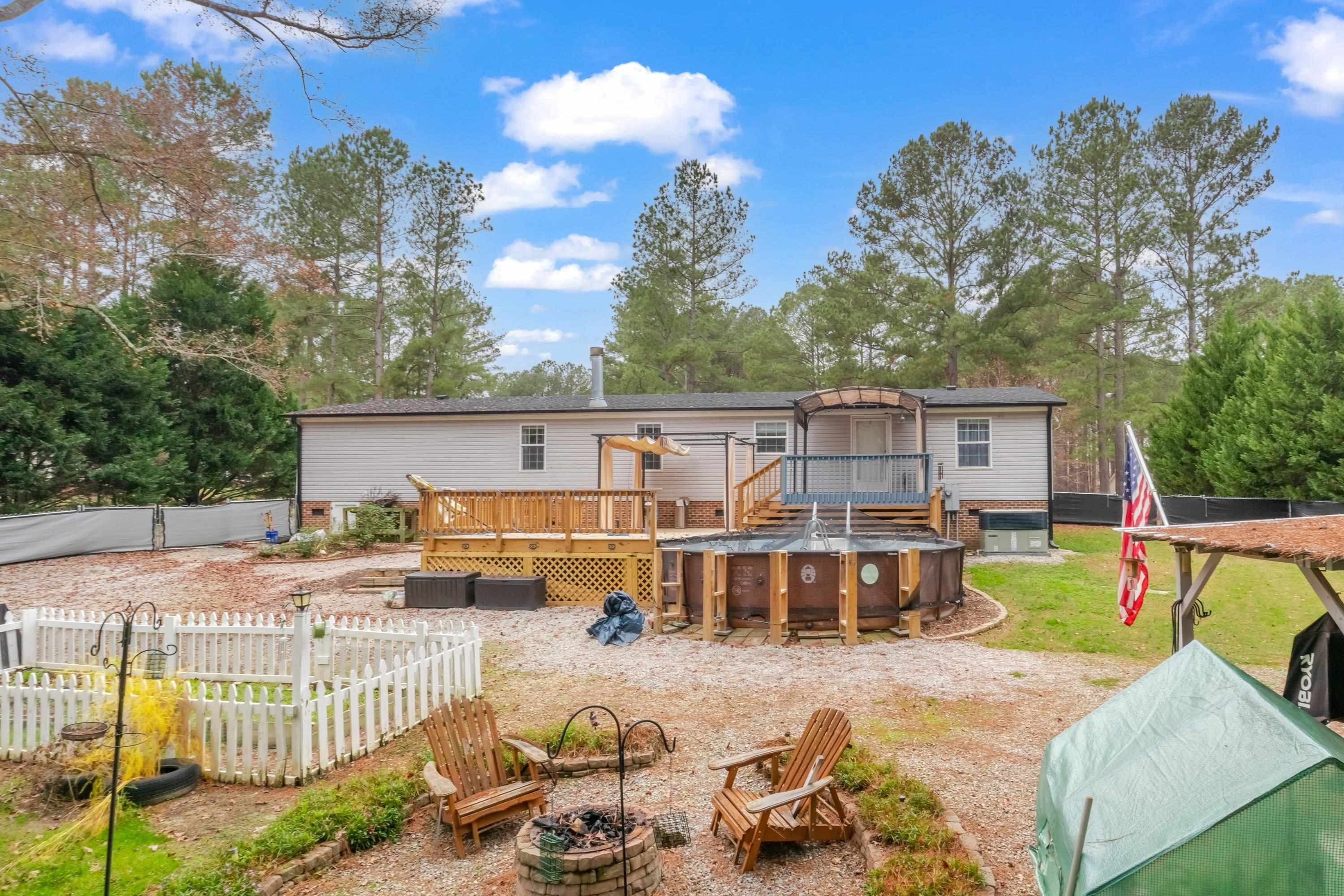 32 Red Oak Drive Smithfield, NC 27577 - Photo 42 of 47 a view of a house with backyard and sitting area