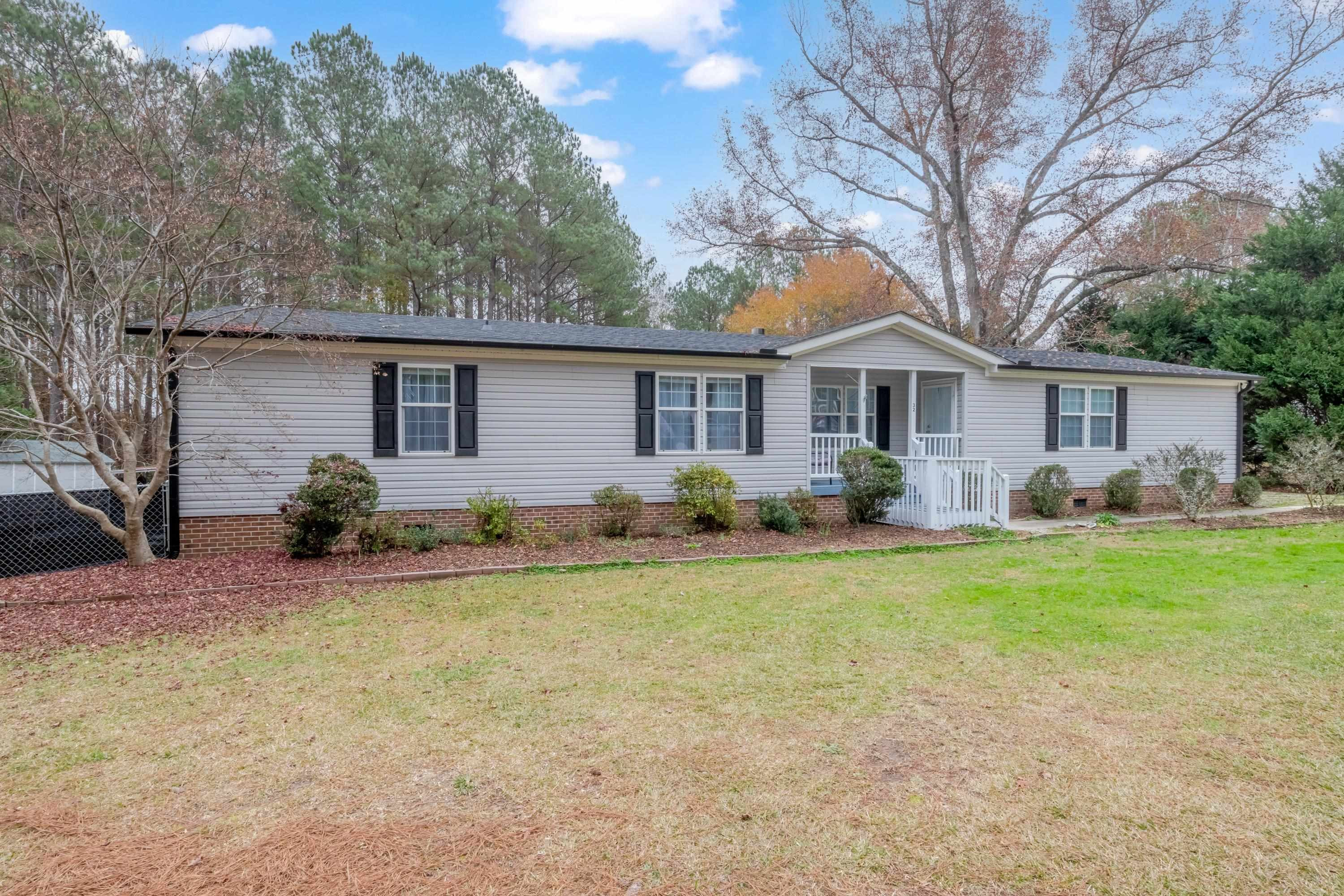 32 Red Oak Drive Smithfield, NC 27577 - Photo 5 of 47 a front view of house with yard and green space