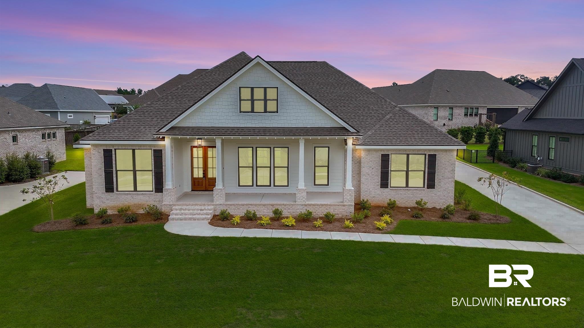 21826 Veranda Boulevard Fairhope, AL 36532 - Photo 1 of 42 Modern inspired farmhouse featuring covered porch, a front lawn, and brick siding