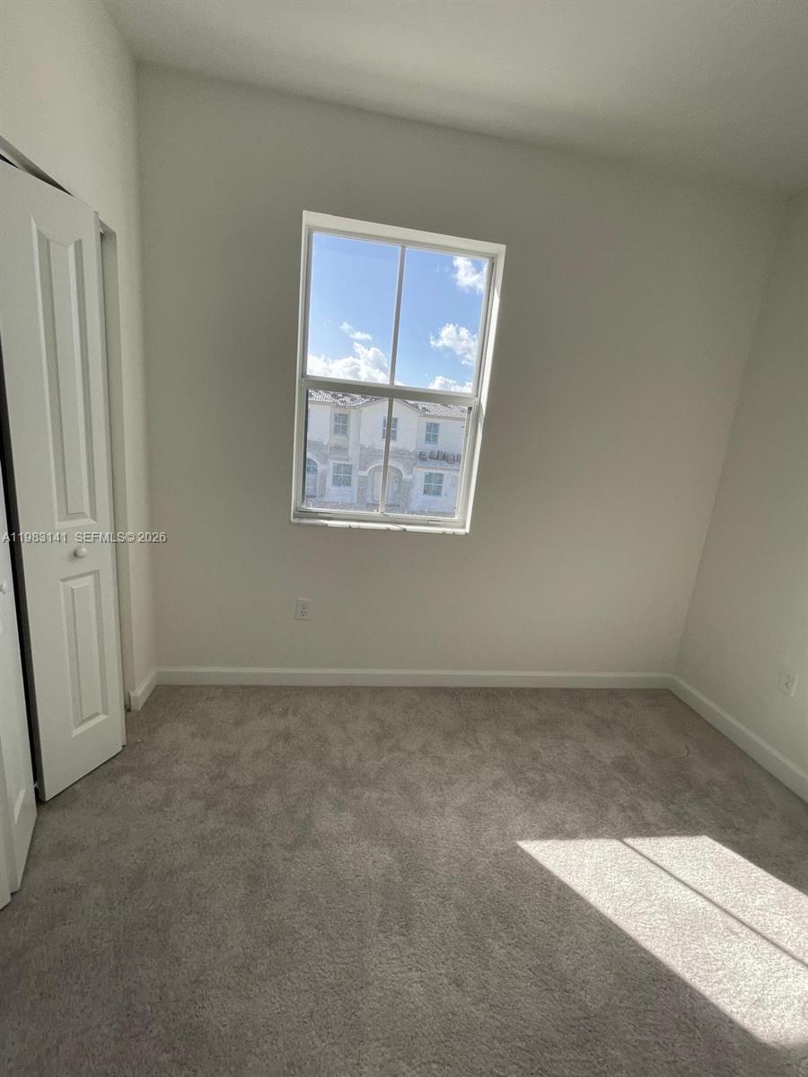 16283 Southwest 292nd Street Homestead, FL 33033 - Photo 11 of 12 an empty room with windows