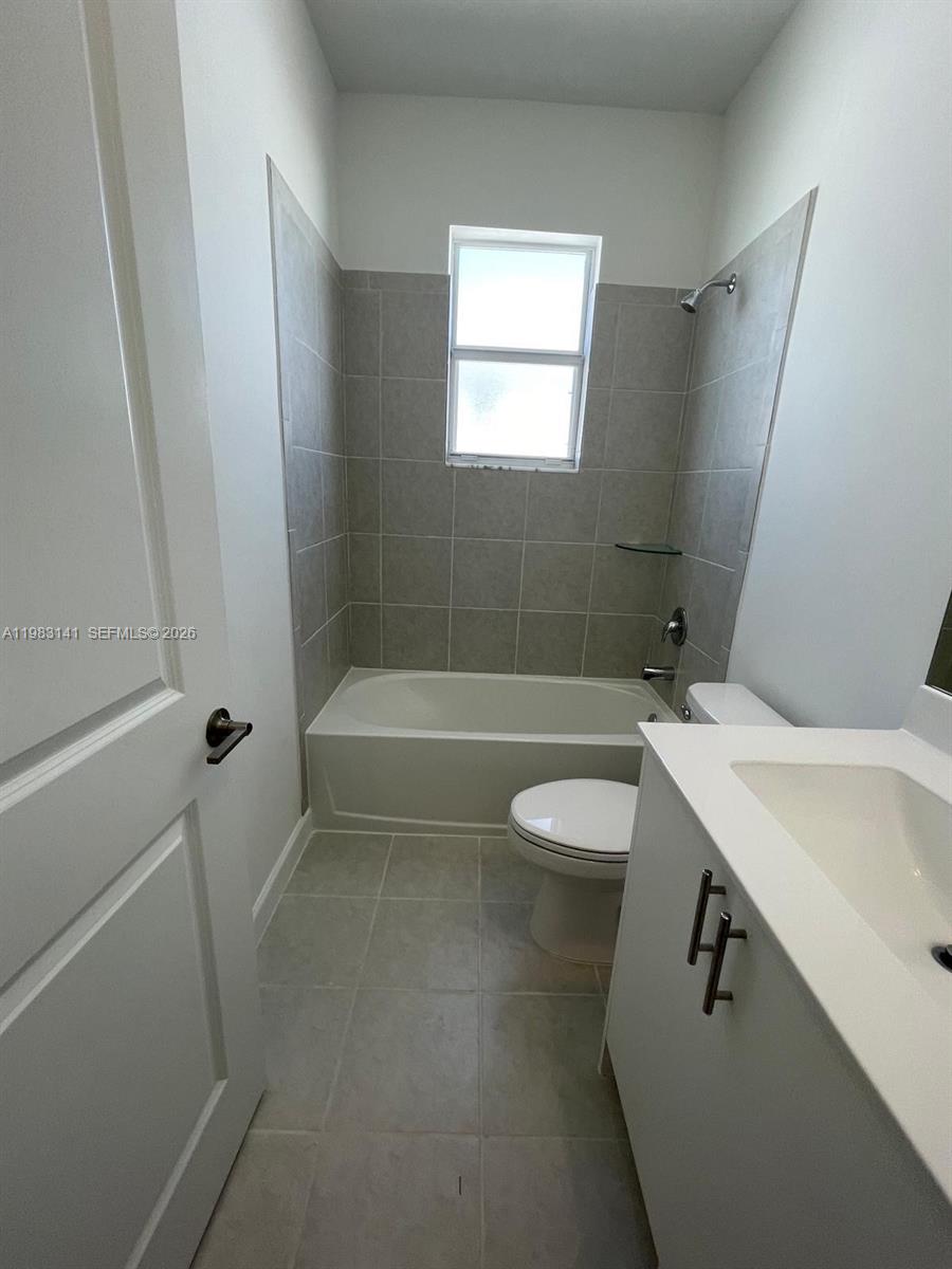 16283 Southwest 292nd Street Homestead, FL 33033 - Photo 7 of 12 a bathroom with a sink a toilet and shower