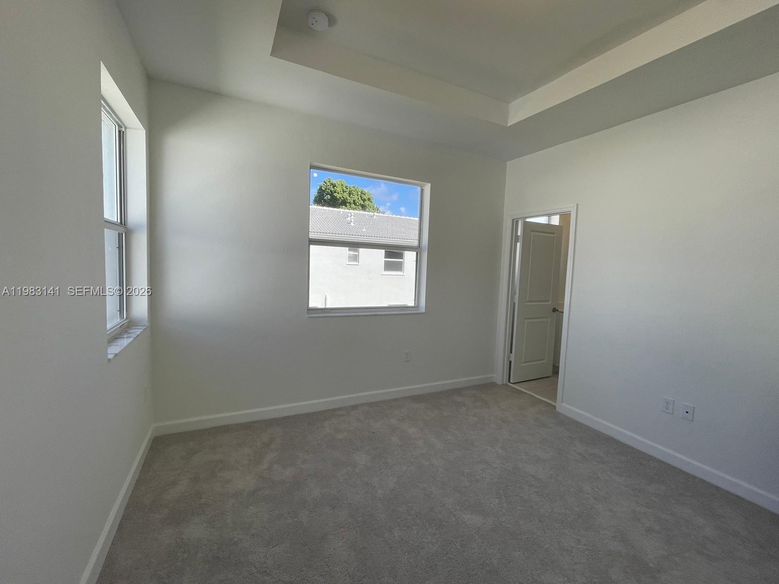 16283 Southwest 292nd Street Homestead, FL 33033 - Photo 9 of 12 an empty room with a window