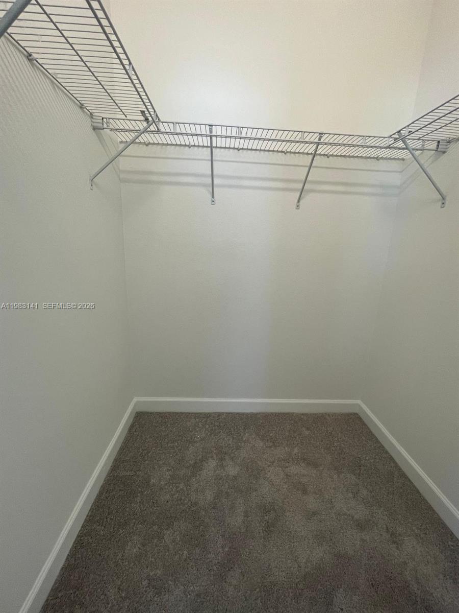 16283 Southwest 292nd Street Homestead, FL 33033 - Photo 10 of 12 a view of a room with racks on the wall