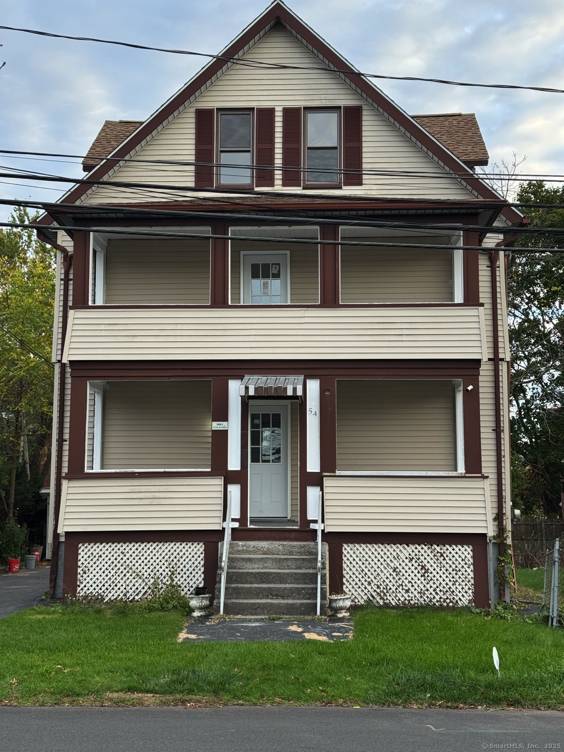 54 Overlook Avenue New Britain, CT 06053 - Photo 1 of 10 a front view of a house with a garden and plants