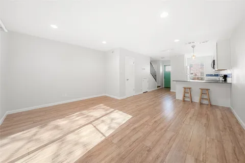 a view of kitchen with wooden floor and outdoor space