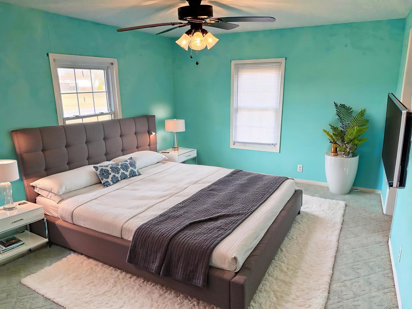 1062 Cedar Lane Metropolis, IL 62960 - Photo 3 of 30 a bedroom with a bed potted plant and a window