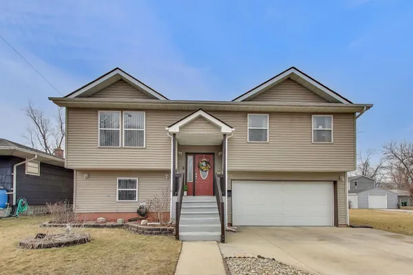 a front view of a house with garage