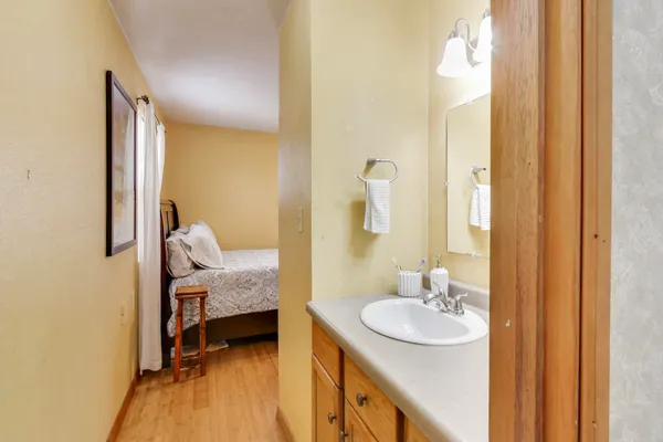 a en suite bathroom with a double vanity sink and a mirror