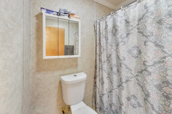 a bathroom with a toilet and a sink