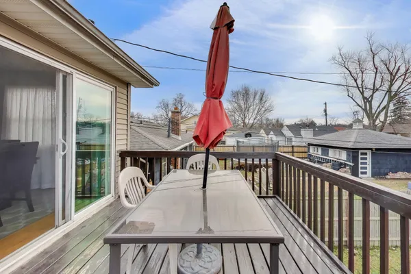 a view of a balcony with furniture