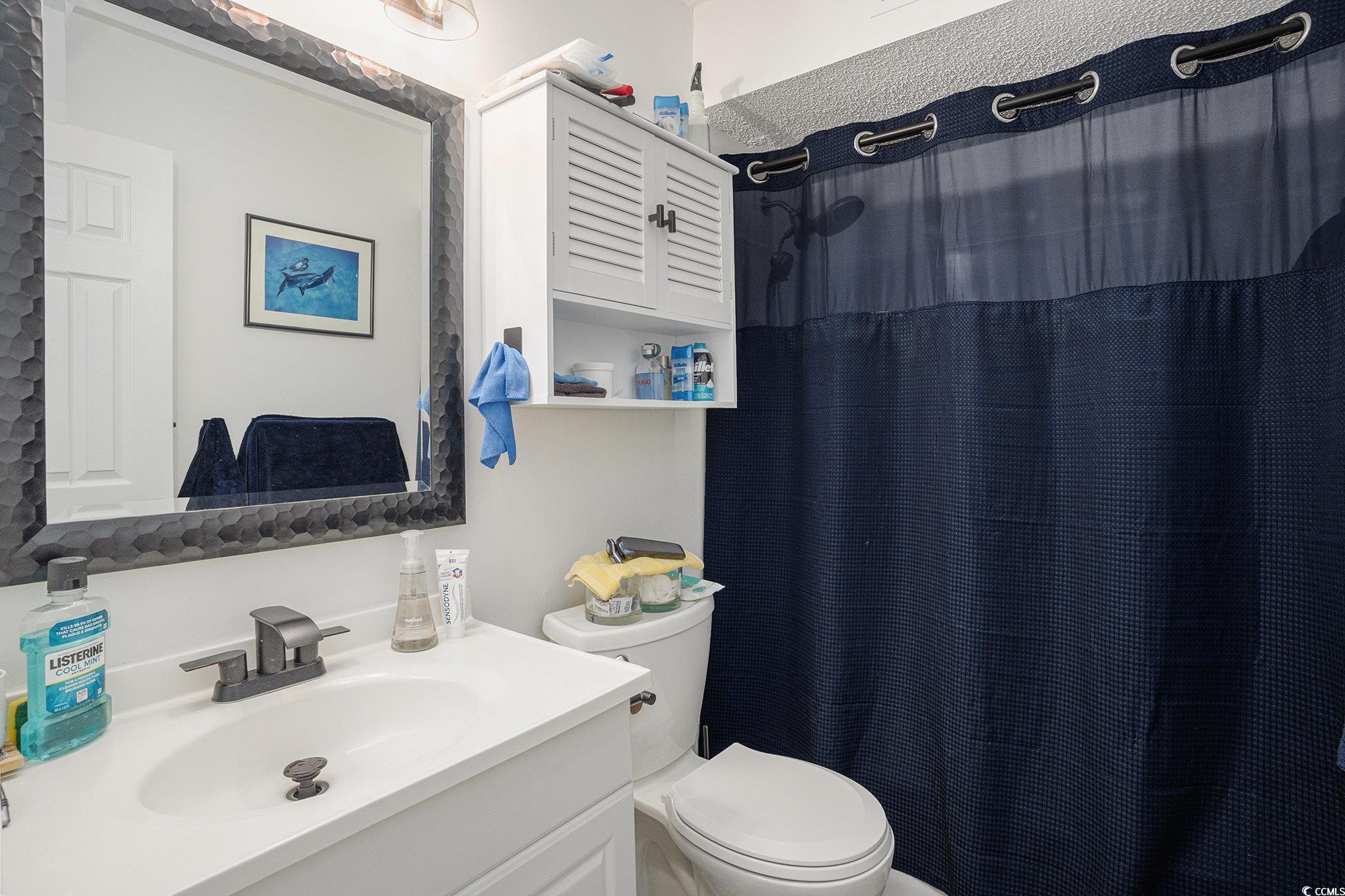 400 Cambridge Circle, Unit L8 Murrells Inlet, SC 29576 - Photo 11 of 22 Full bath with curtained shower and vanity