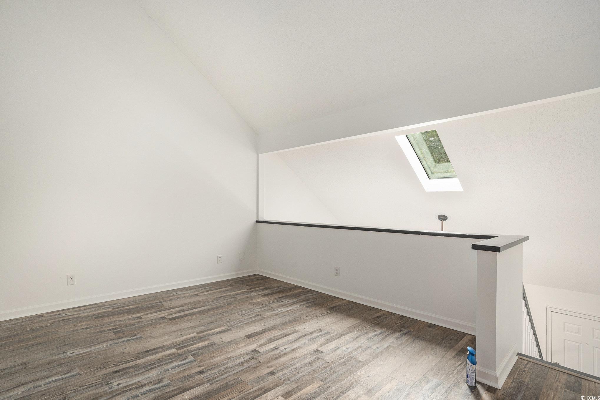 400 Cambridge Circle, Unit L8 Murrells Inlet, SC 29576 - Photo 13 of 22 Bonus room featuring a skylight, wood finished floors, and lofted ceiling