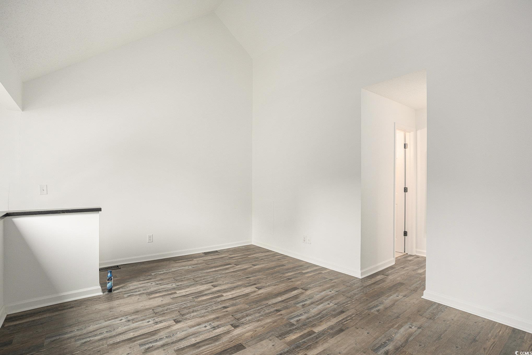 400 Cambridge Circle, Unit L8 Murrells Inlet, SC 29576 - Photo 14 of 22 Spare room with lofted ceiling and dark wood finished floors