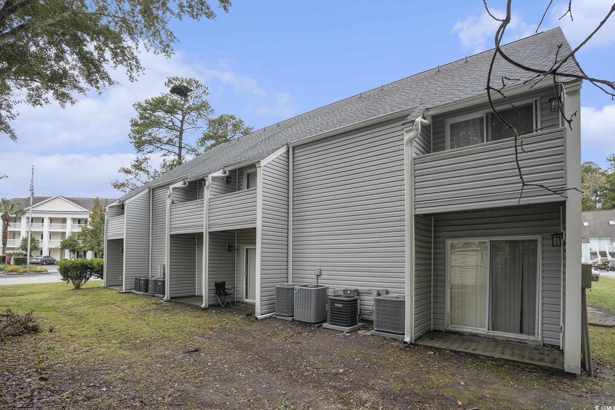 400 Cambridge Circle, Unit L8 Murrells Inlet, SC 29576 - Photo 17 of 22 Rear view of property with roof with shingles and a balcony