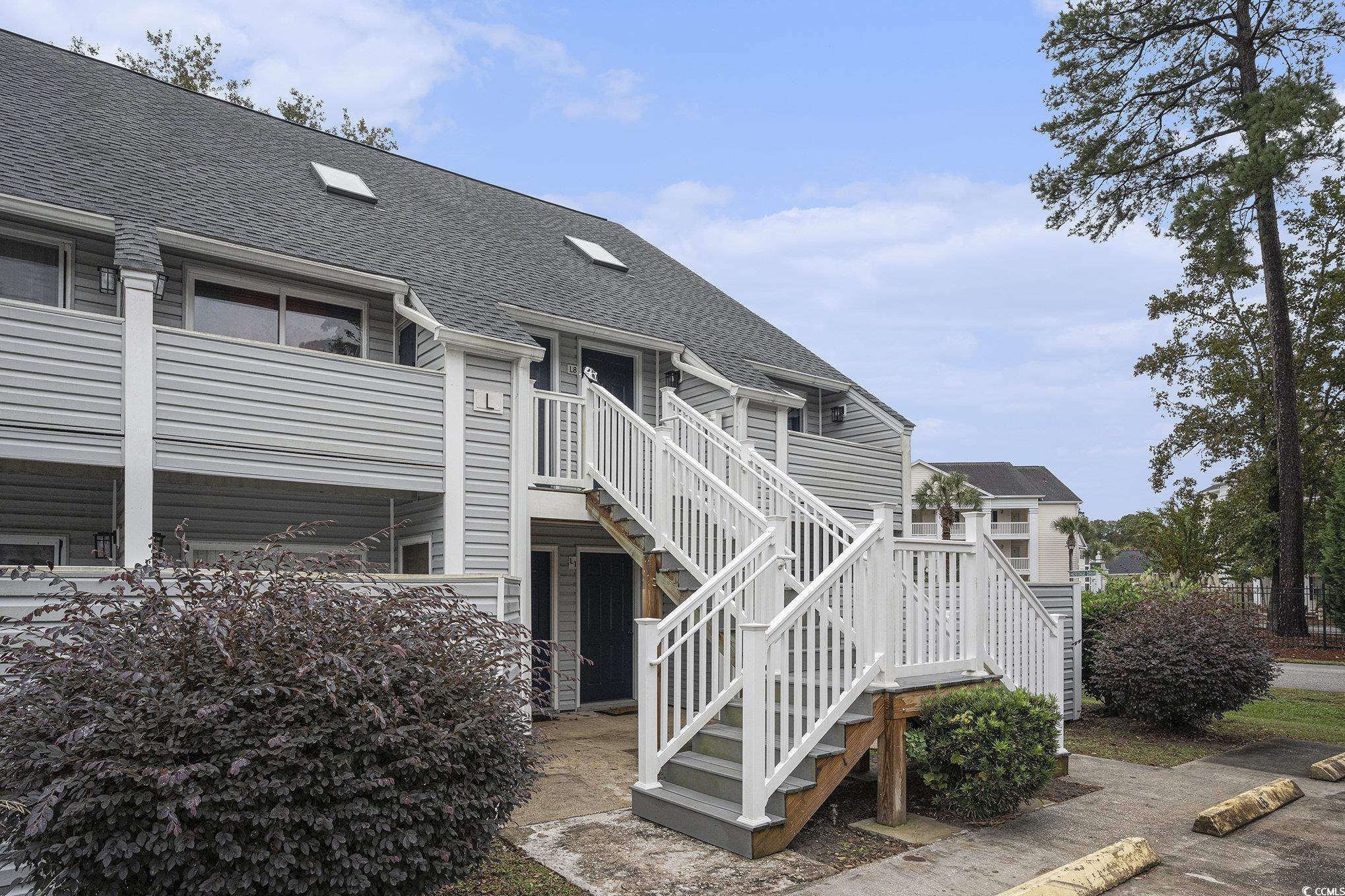400 Cambridge Circle, Unit L8 Murrells Inlet, SC 29576 - Photo 19 of 22 View of building exterior with stairs