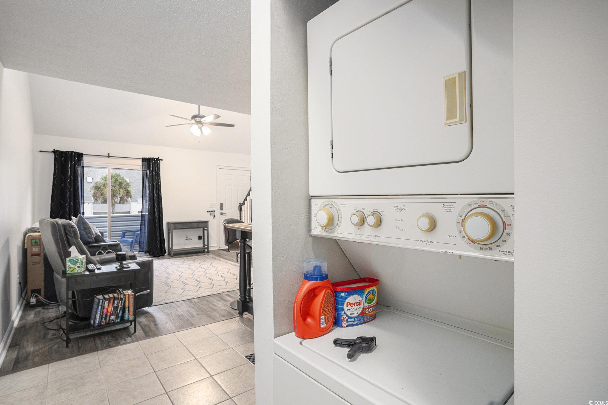 400 Cambridge Circle, Unit L8 Murrells Inlet, SC 29576 - Photo 7 of 22 Laundry area with light tile patterned floors, stacked washing machine and dryer, ceiling fan, and vaulted ceiling