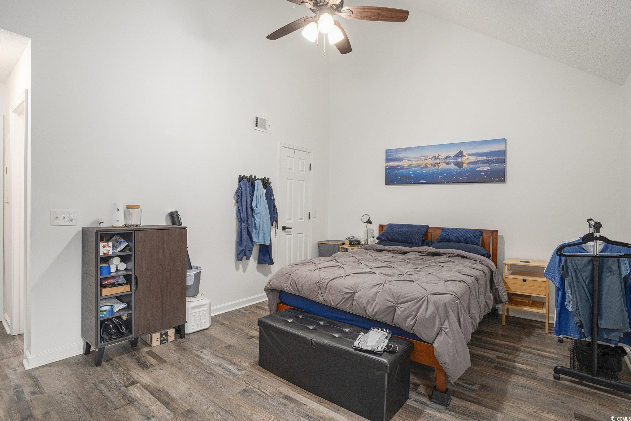 400 Cambridge Circle, Unit L8 Murrells Inlet, SC 29576 - Photo 8 of 22 Bedroom with wood finished floors, high vaulted ceiling, and a ceiling fan