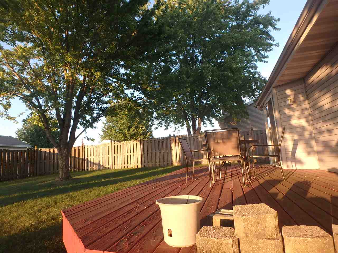 5402 Rockingham Drive Loves Park, IL 61111 - Photo 3 of 5 a patio with table and chairs