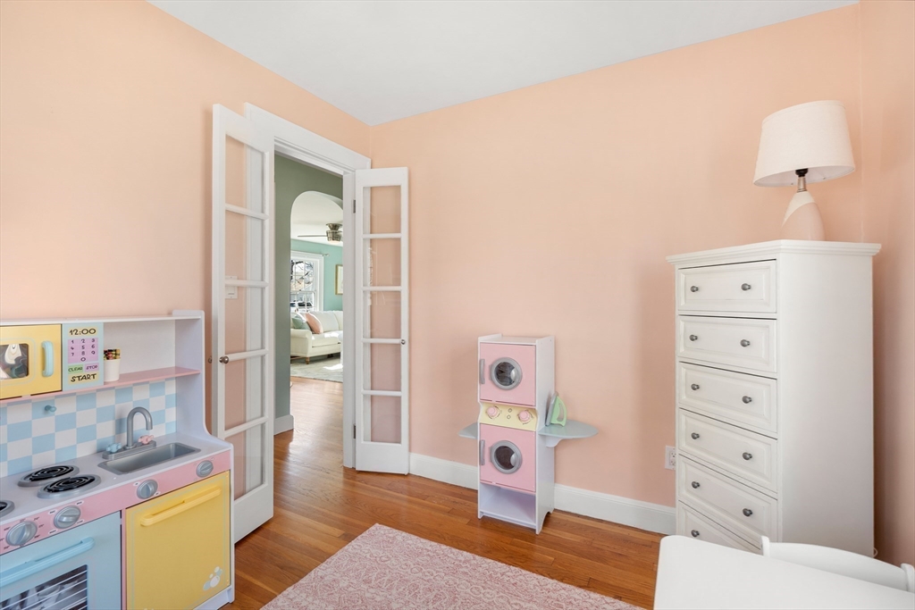 38 Carlton Road Marblehead, MA 01945 - Photo 25 of 36 a bedroom with a bed and a dresser in it