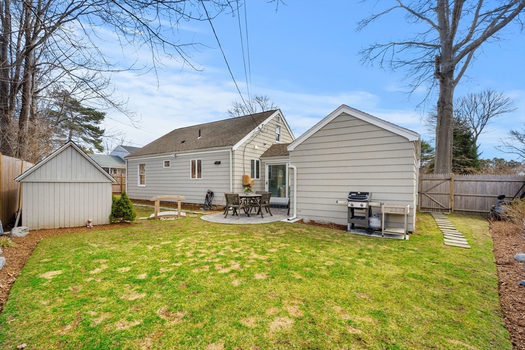38 Carlton Road Marblehead, MA 01945 - Photo 28 of 36 a view of a house with a patio and a yard