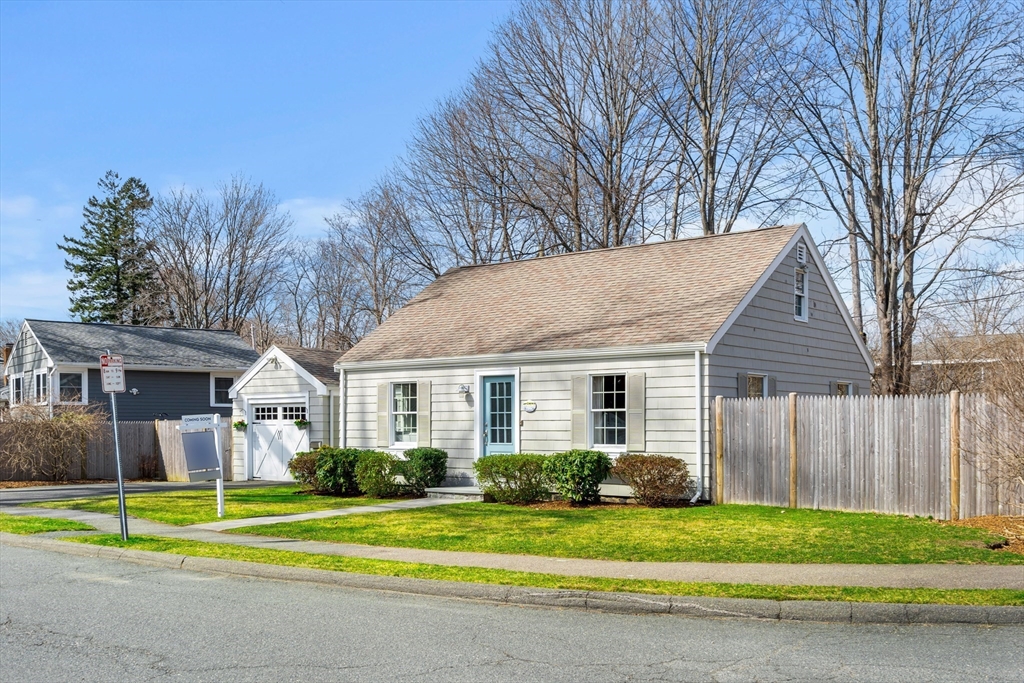38 Carlton Road Marblehead, MA 01945 - Photo 3 of 36 a front view of a house with a yard and trees