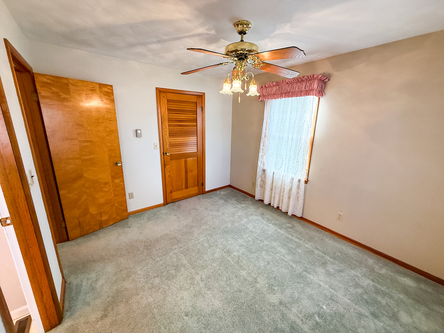 218 South 3rd Street Southwest Clay City, IL 62824 - Photo 22 of 63 an empty room with windows and fan