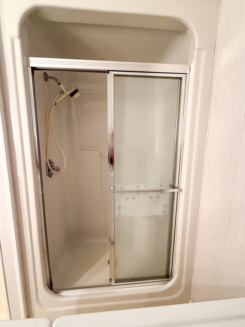 218 South 3rd Street Southwest Clay City, IL 62824 - Photo 36 of 63 a bathroom with a glass shower door