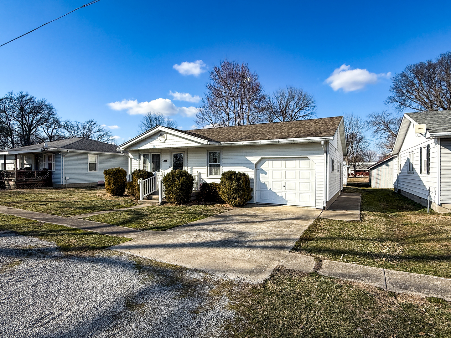 218 South 3rd Street Southwest Clay City, IL 62824 - Photo 4 of 63 a front view of a house with a yard