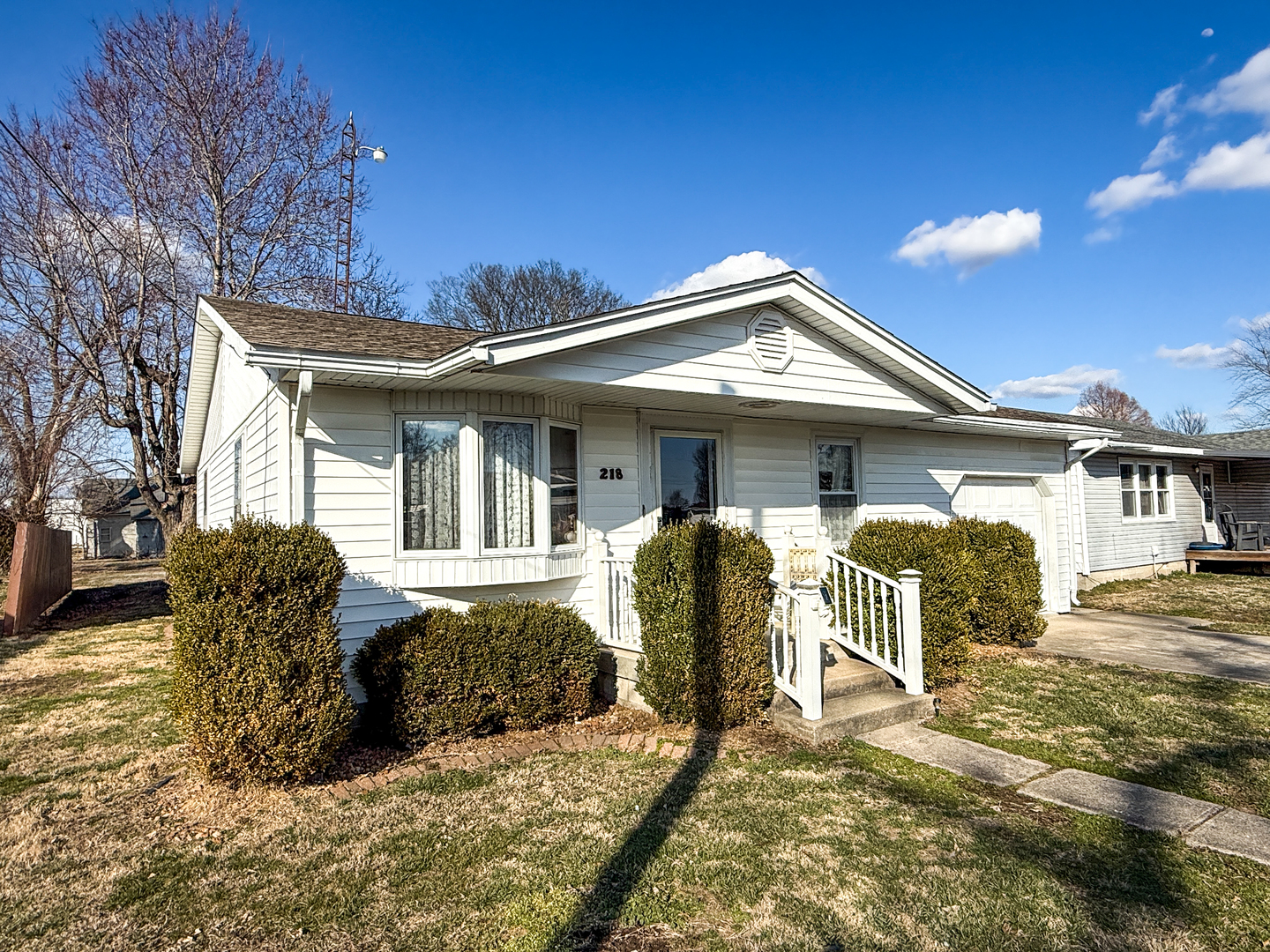 218 South 3rd Street Southwest Clay City, IL 62824 - Photo 60 of 63 a front view of a house with a yard outdoor seating and garage