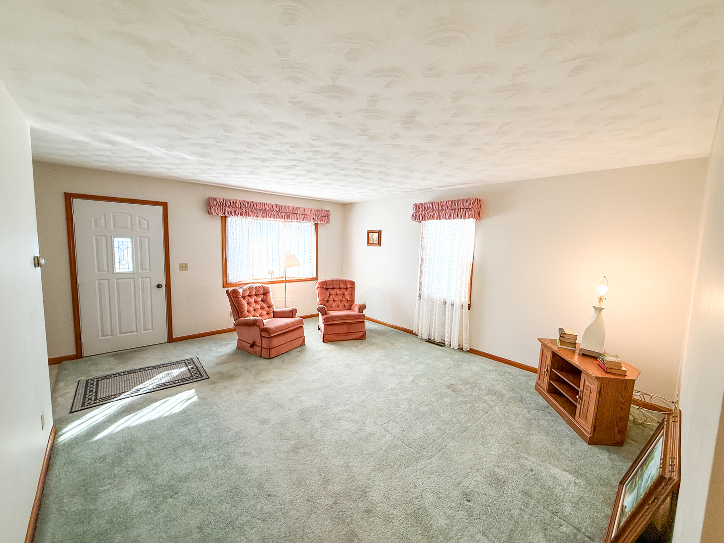 218 South 3rd Street Southwest Clay City, IL 62824 - Photo 8 of 63 a view of a livingroom with lounge chair and a window