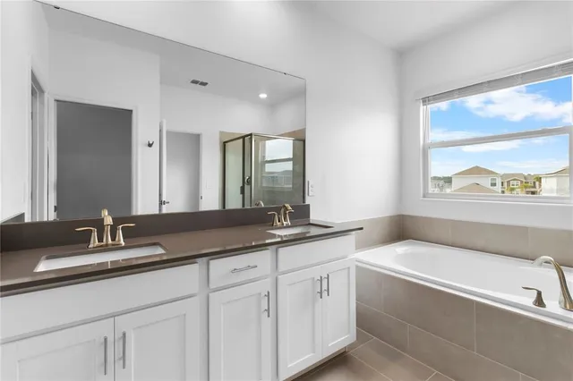 wooden floor and utility room with a sink
