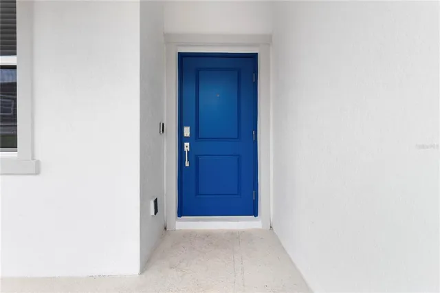 an aerial view of a residential houses with outdoor space and swimming pool