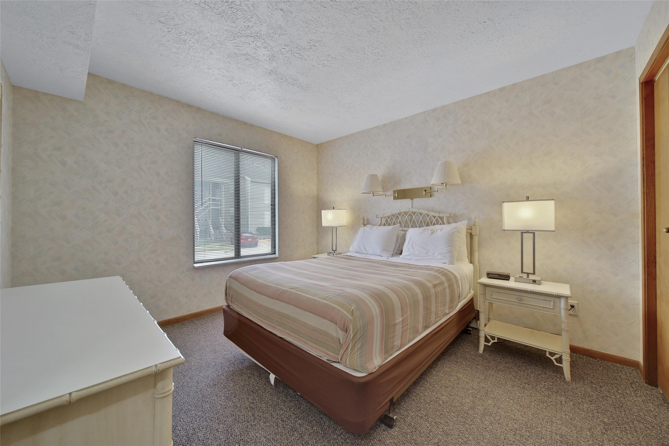 1000 April Sound Boulevard Conroe, TX 77356 - Photo 14 of 46 a spacious bedroom with a bed and a table