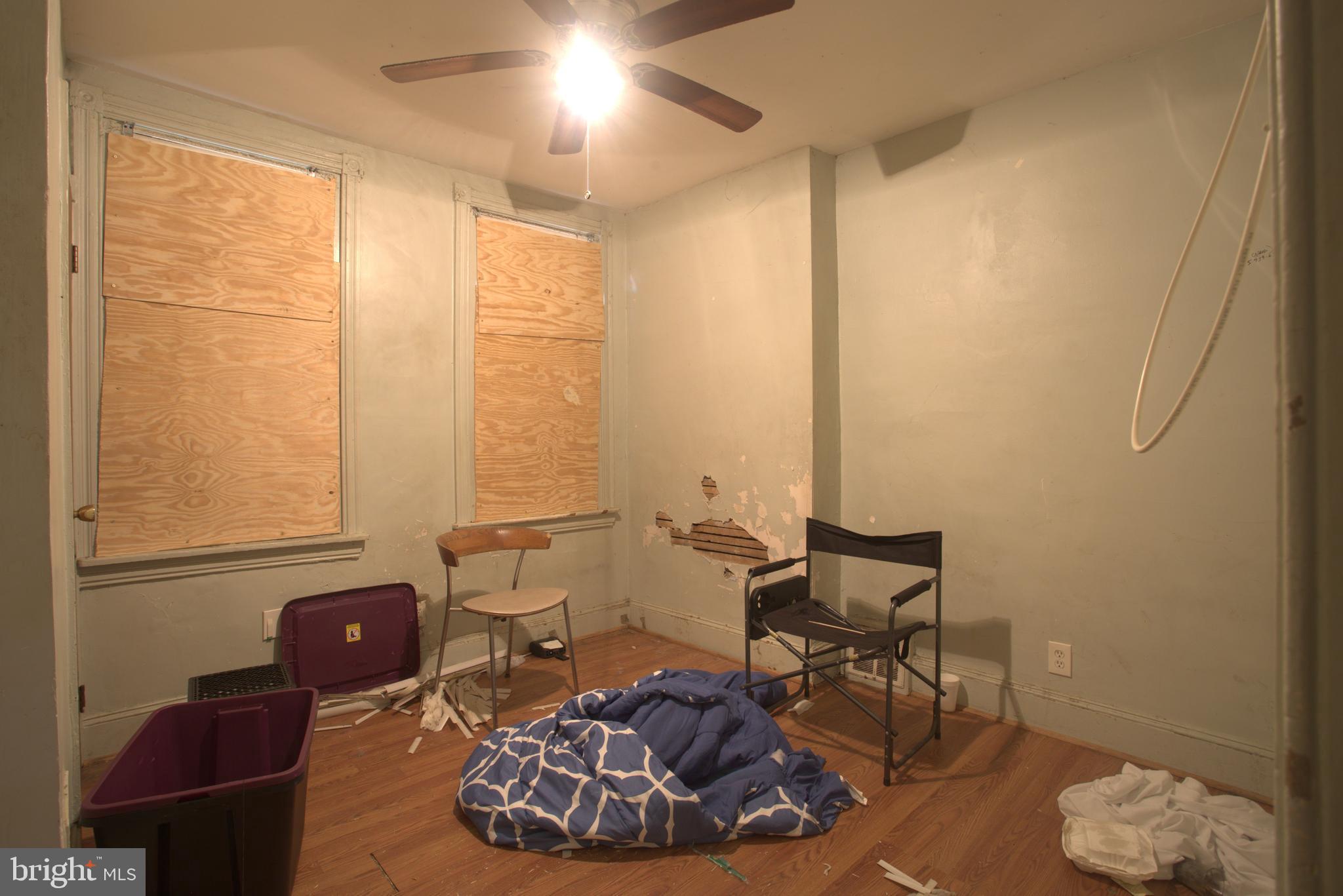 2140 South Simpson Street Philadelphia, PA 19142 - Photo 6 of 12 a living room with furniture and a window