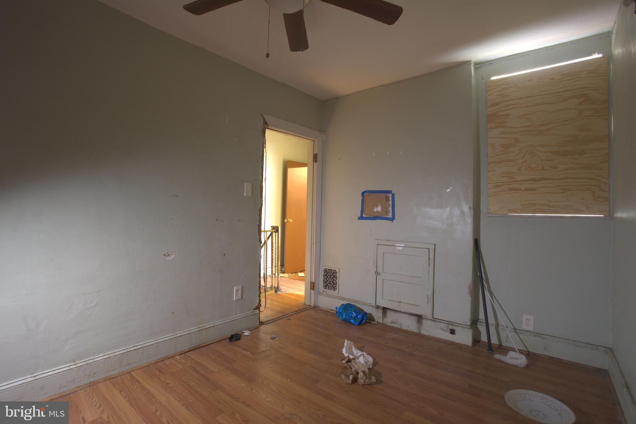 2140 South Simpson Street Philadelphia, PA 19142 - Photo 10 of 12 an empty room with a door