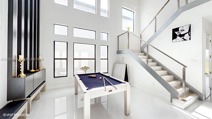 8350 Royal County Down Road Boca Raton, FL 33434 - Photo 10 of 52 a view of staircase with white walls and a window