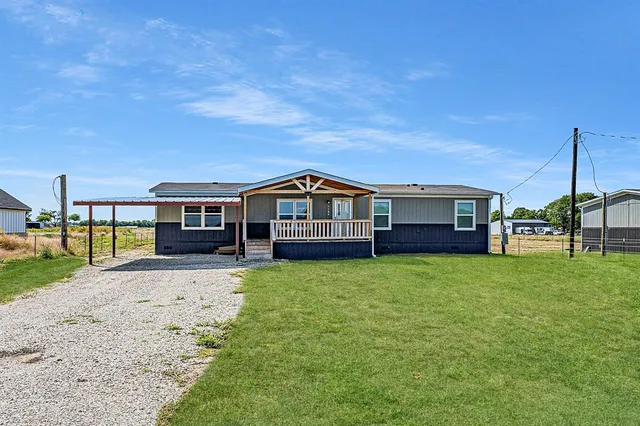 a house view with a garden space
