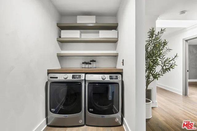a bathroom with a sink toilet a mirror and shower