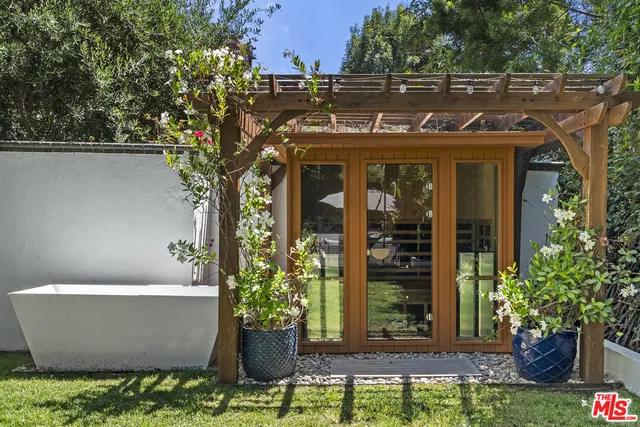 an outdoor space with furniture and umbrella