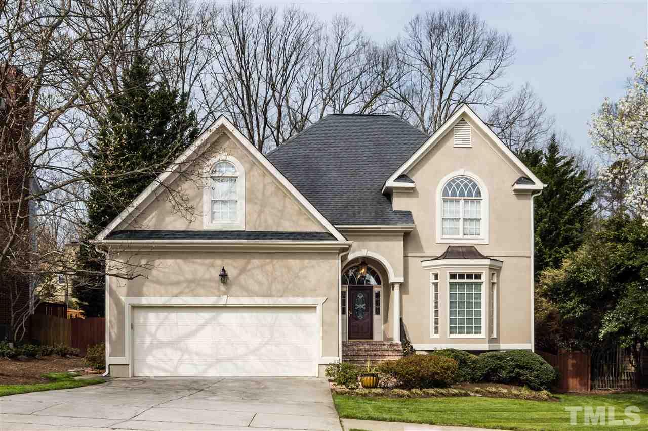6521 Arbor Grande Way Raleigh, NC 27615 - Photo 1 of 12 a front view of a house with a yard