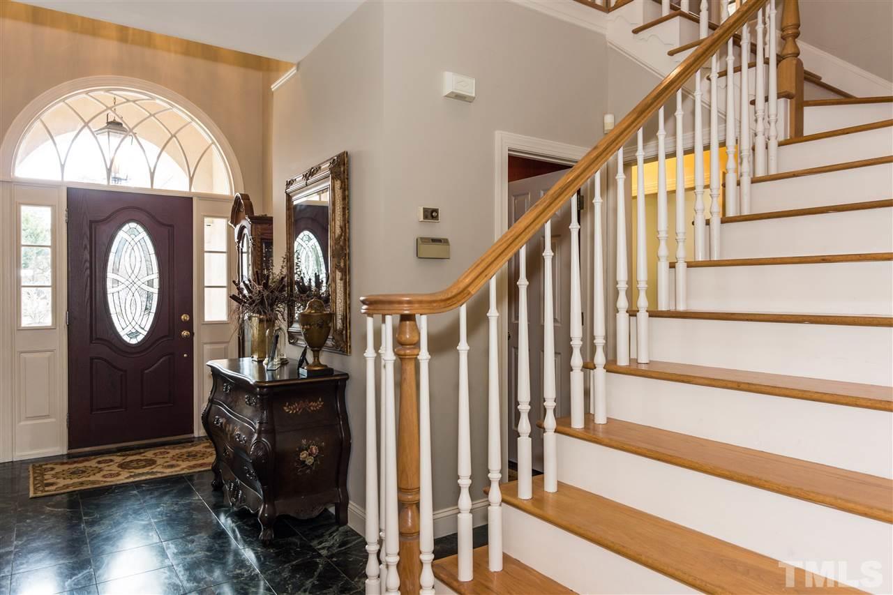 6521 Arbor Grande Way Raleigh, NC 27615 - Photo 2 of 12 a view of staircase with wooden floor and a window