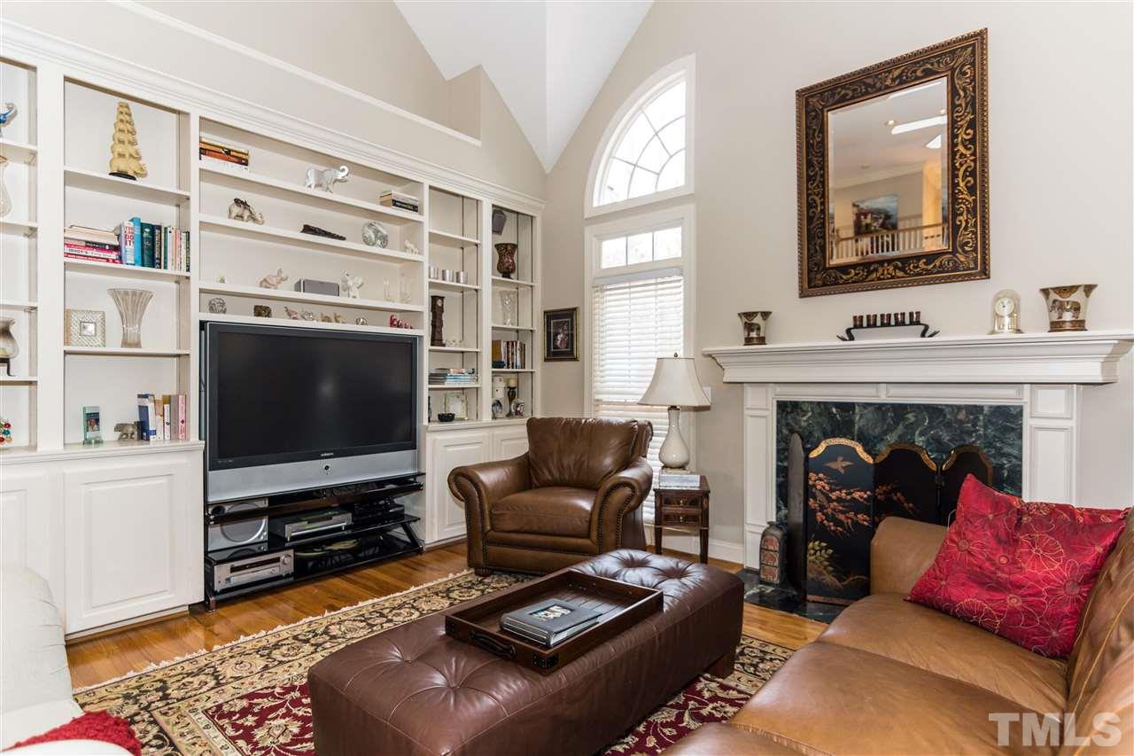 6521 Arbor Grande Way Raleigh, NC 27615 - Photo 6 of 12 a living room with furniture and a flat screen tv