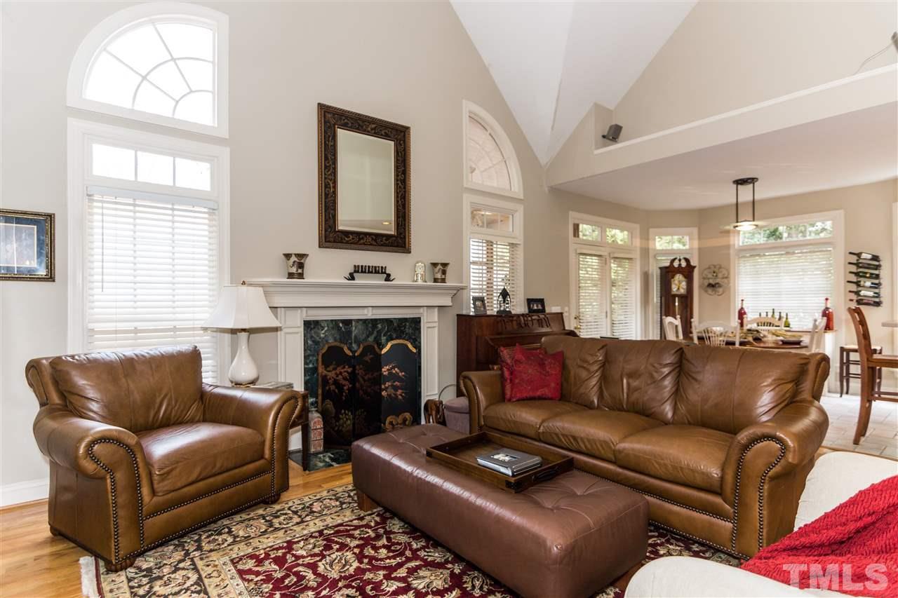 6521 Arbor Grande Way Raleigh, NC 27615 - Photo 7 of 12 a living room with furniture and a fireplace