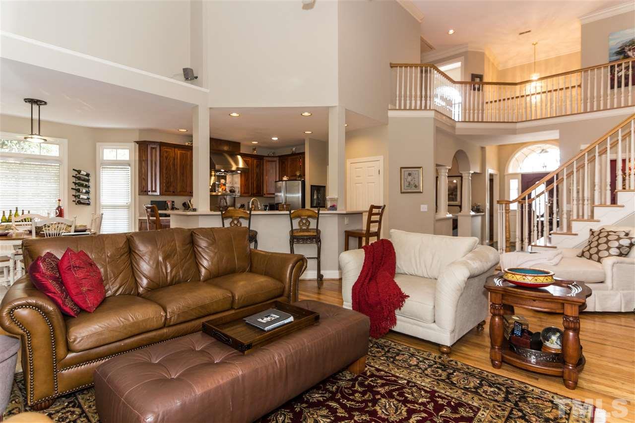 6521 Arbor Grande Way Raleigh, NC 27615 - Photo 8 of 12 a living room with furniture and a view of kitchen