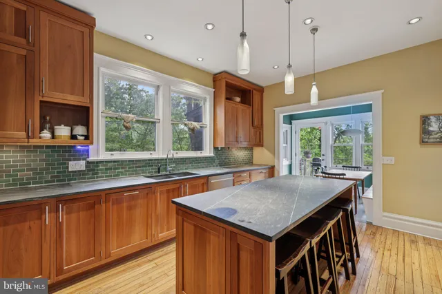 a living room with furniture rug and window