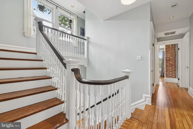a bedroom with a bed and a fireplace